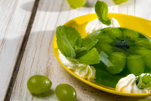 stock image Grape jelly as a dessert with cream