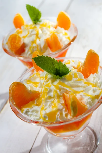 Dessert with mandarins, jelly and cream — Stock Photo, Image