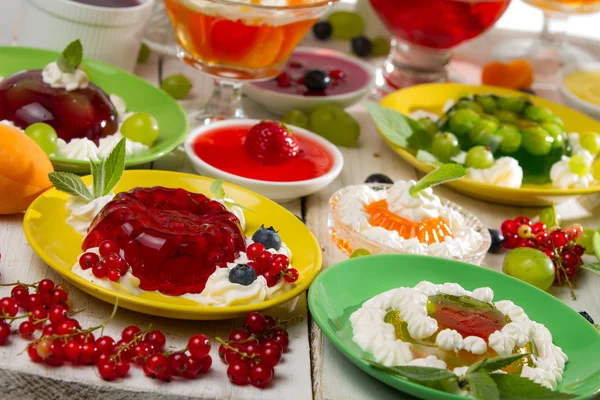Close-up of various colored jelly with fruits — Stock Photo, Image