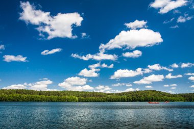 Canoe trip on the lake in summer clipart