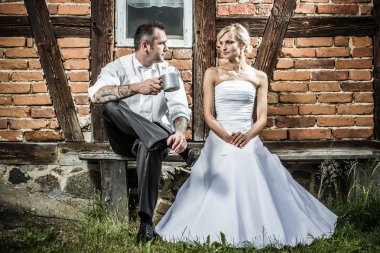 Young couple in front of old vintage house clipart