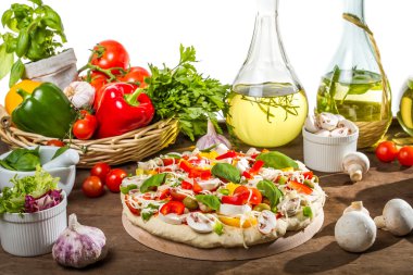 Preparations for baking pizza from fresh vegetables clipart