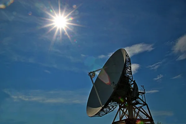 Satellite dish with sunburst — Stock Photo, Image