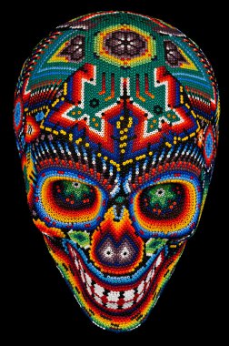 Beaded skull isolated on black clipart