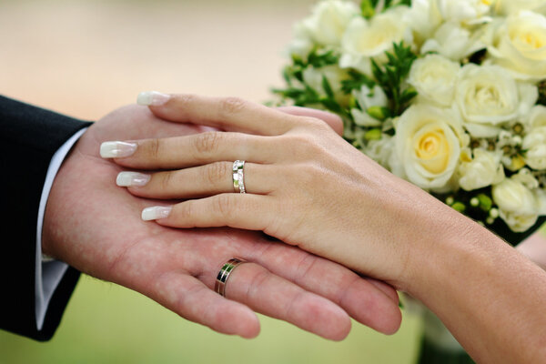 Wedding hands and golden rings