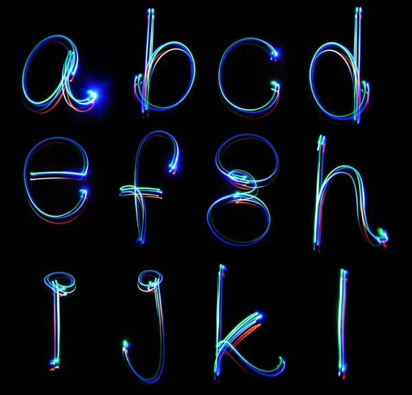 Alfabetos de luz de néon manuscritos — Fotografia de Stock
