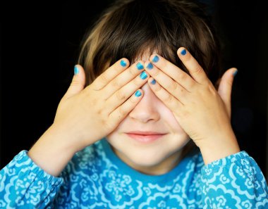 Little girl with hands covering her eyes clipart