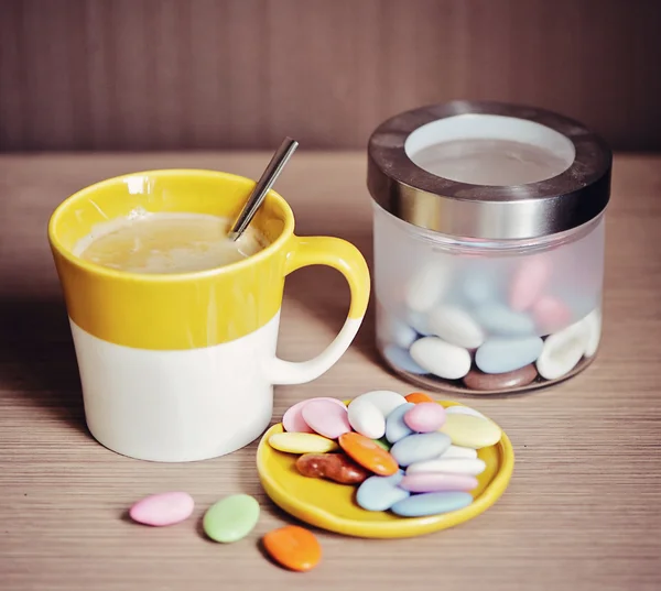 stock image Cup of coffee with cookies on a table