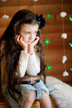 Little girl in anticipation of Christmas night clipart