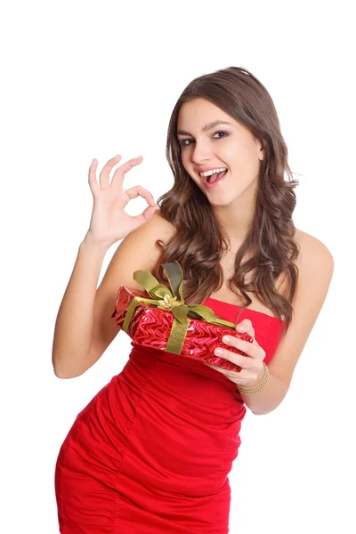 Happy red dressed girl with a gift — Stock Photo, Image