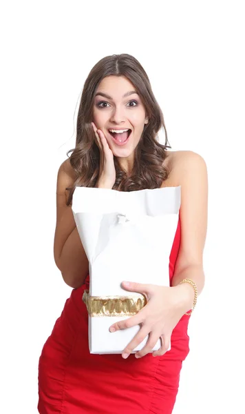 Surprised brunette with a gift in her hand — Stock Photo, Image