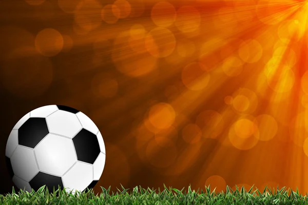 Voetbal in groene gras met kleurrijke achtergrond — Stockfoto