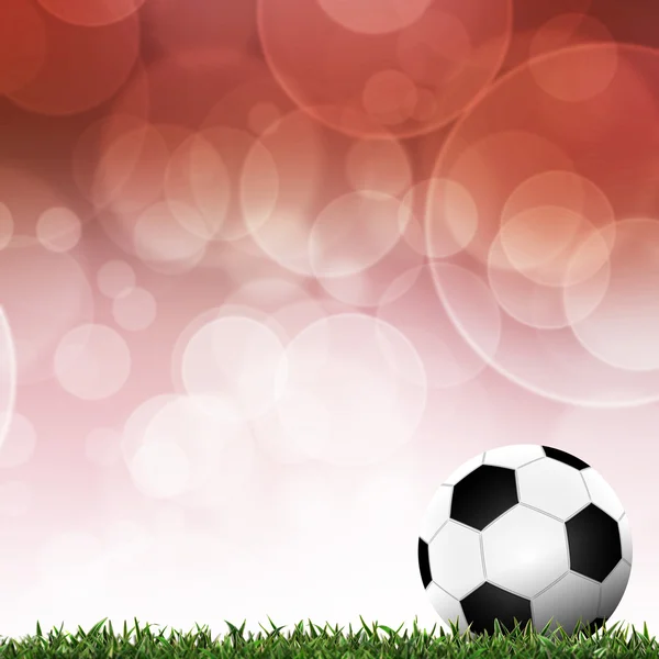 Fotboll i gröngräset med bakgrund färgglada — Stockfoto