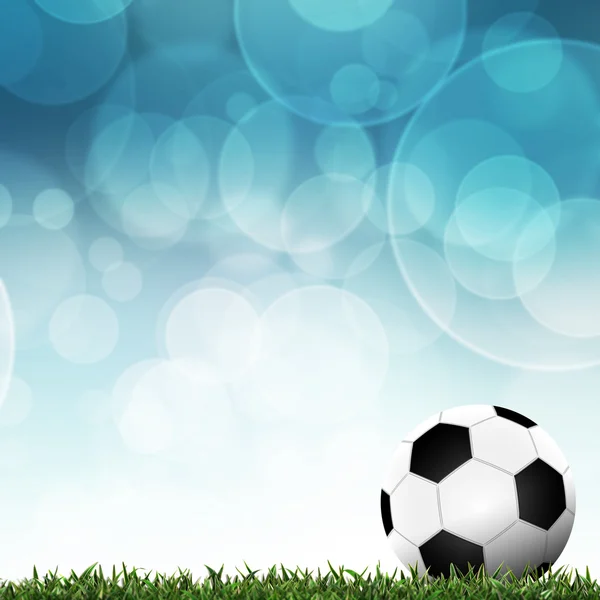 Fútbol en hierba verde con fondo colorido —  Fotos de Stock