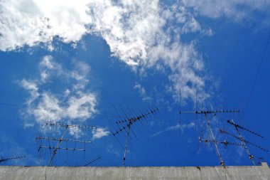 TV aerial on a rooftop clipart