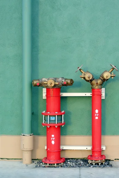 Hydrant with water hoses and fire extinguish equipment — Stock Photo, Image