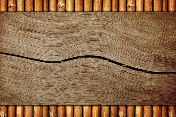 Wood board on bamboo background — Stock Photo, Image