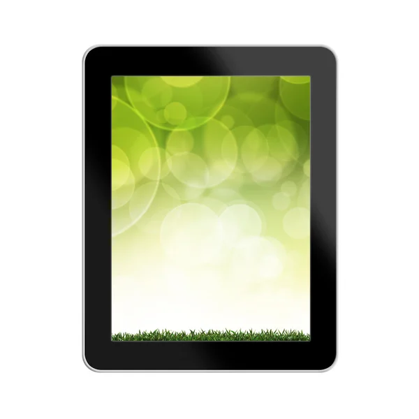 टॅबलेट संगणक रंगीत पार्श्वभूमी हिरवा गवत — स्टॉक फोटो, इमेज