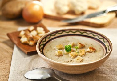 Soup and ingredients on the table clipart