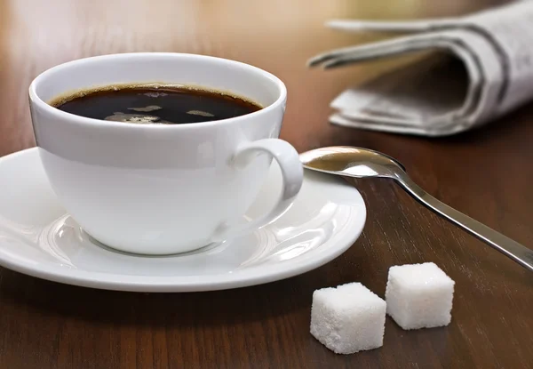 stock image Coffee break with newspaper