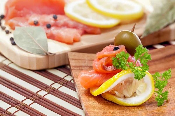 stock image Salmon snack on the wooden plate