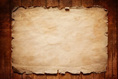 Old paper on wooden board clipart