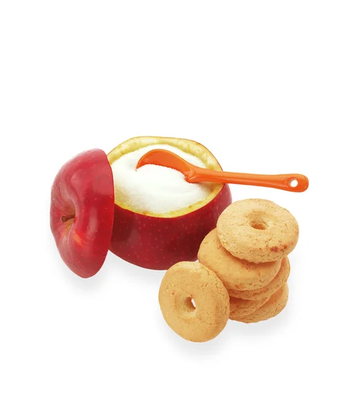 Cukiernica z czerwone jabłko z fruktoza wewnątrz i ciasteczka obok — Zdjęcie stockowe