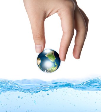 Earth in hand over water (Elements of this image furnished by N clipart