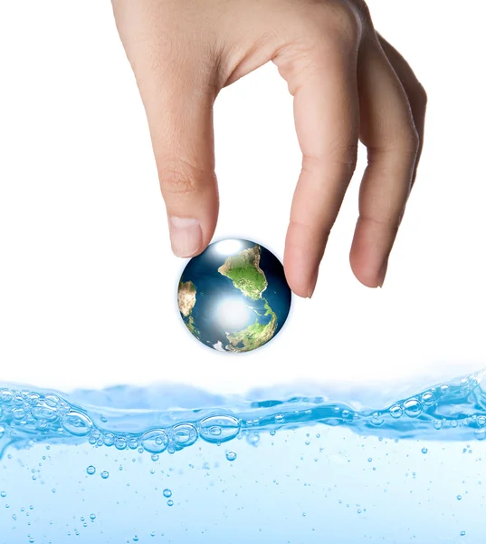 Earth in hand over water (Elements of this image furnished by N — Stock Photo, Image