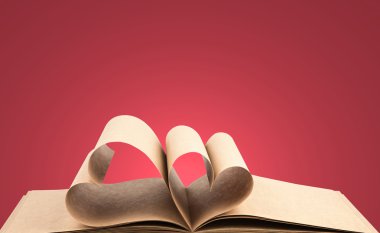 Book with opened pages of shape of heart clipart