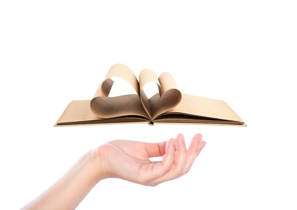 Beautiful woman hand holding Book with opened pages of shape of — Stock Photo, Image