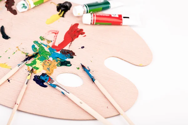 Wooden art palette with paint — Stock Photo, Image