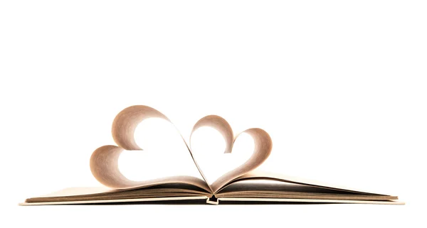 Kniha s otevřené stránky tvaru srdce izolovaných na bílém pozadí — Stock fotografie