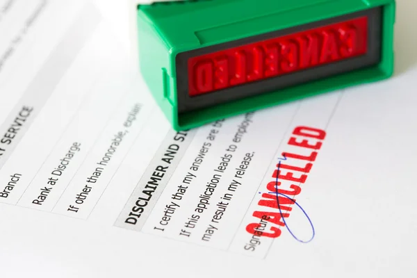 Cancelled letter rubber stamp on application form — Stock Photo, Image