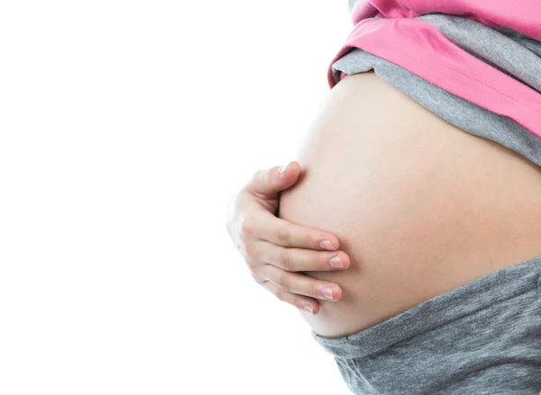Donna incinta che tocca la pancia con la mano — Foto Stock