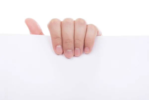 Ženská ruka drží bílý prázdný papír izolovaných na bílém poza — Stock fotografie