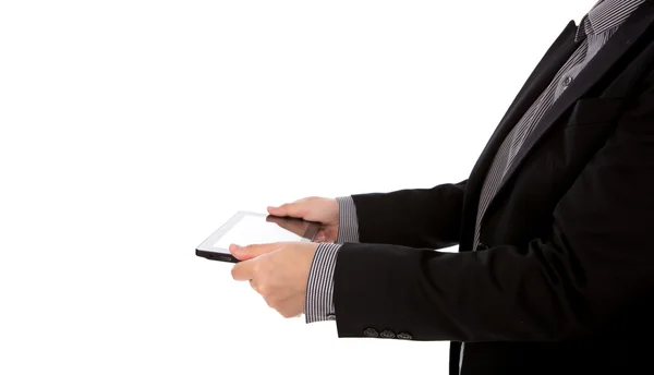 Affärsman med hjälp av en pekskärm enheten mot vita bak — Stockfoto
