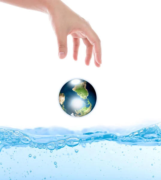 Earth drop from hand over water (Elements of this image furnishe Stock Picture