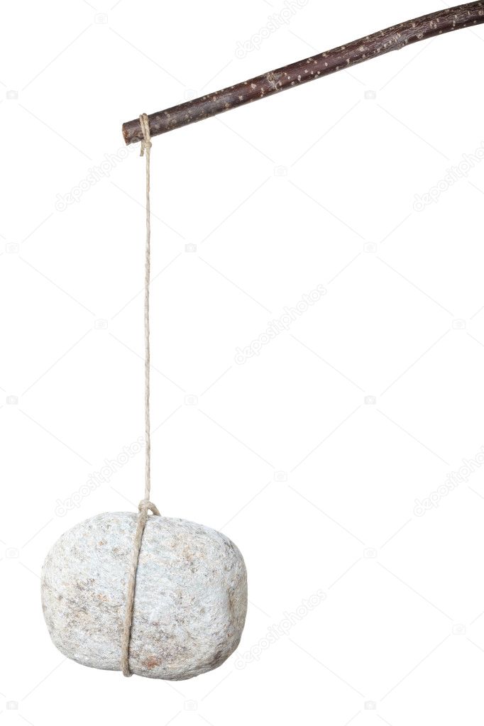 Stone hanging by a string on white
