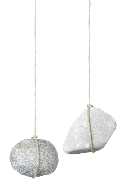 stock image Stone hanging by a string, risk concept