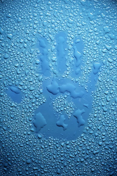 Handprint in water drops — Stock Photo, Image