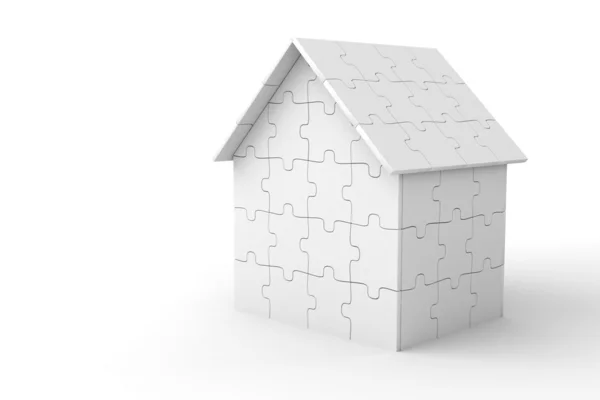 Дом из кусочков головоломки — стоковое фото