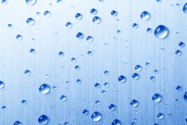 Kapky vody na kovovém povrchu — Stock fotografie