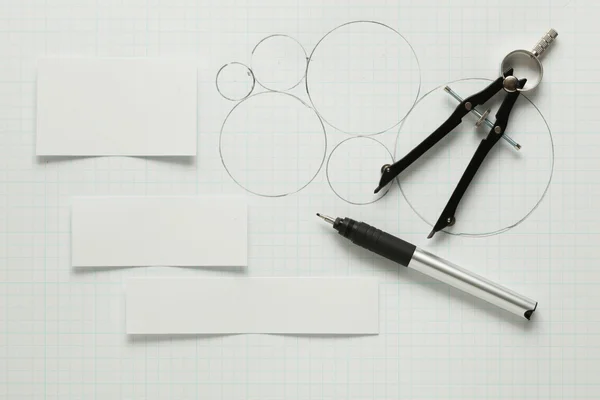 Blank pieces of paper with pen & compass — Stock Photo, Image