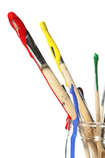 Paint brushes covered in paint — Stok fotoğraf
