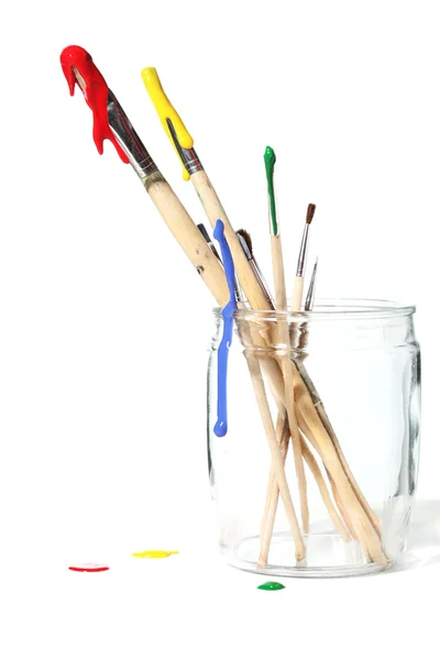 Paint brushes covered in paint — Stok fotoğraf