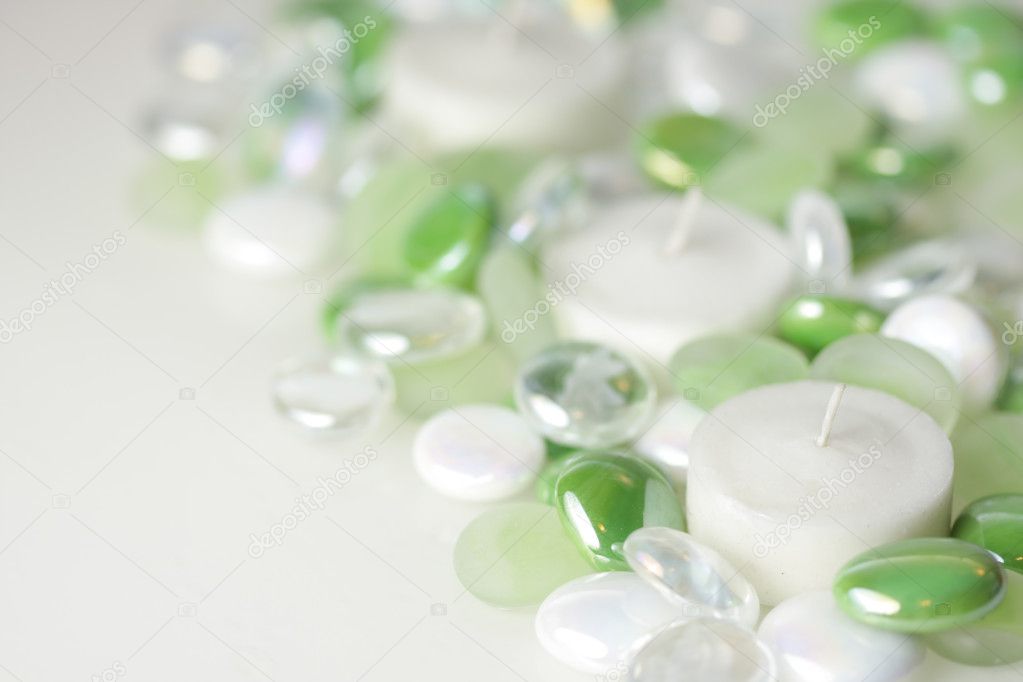 Candles surrounded by glass beads