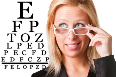 Wondering Businesswoman Looking at an eyechart clipart