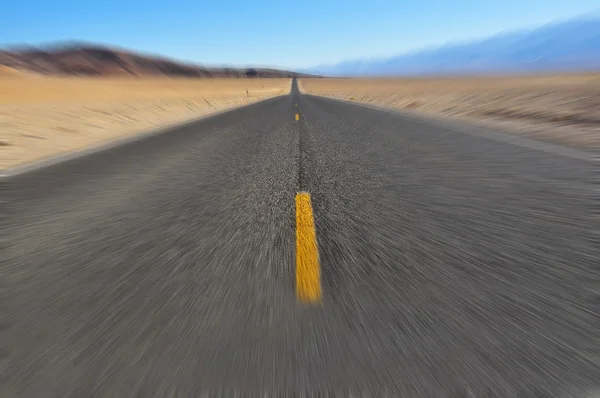 Road in Death Valley with motion blur — Stock Photo, Image
