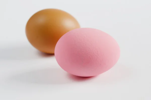 Pink eggs and brown eggs — Stock Photo, Image